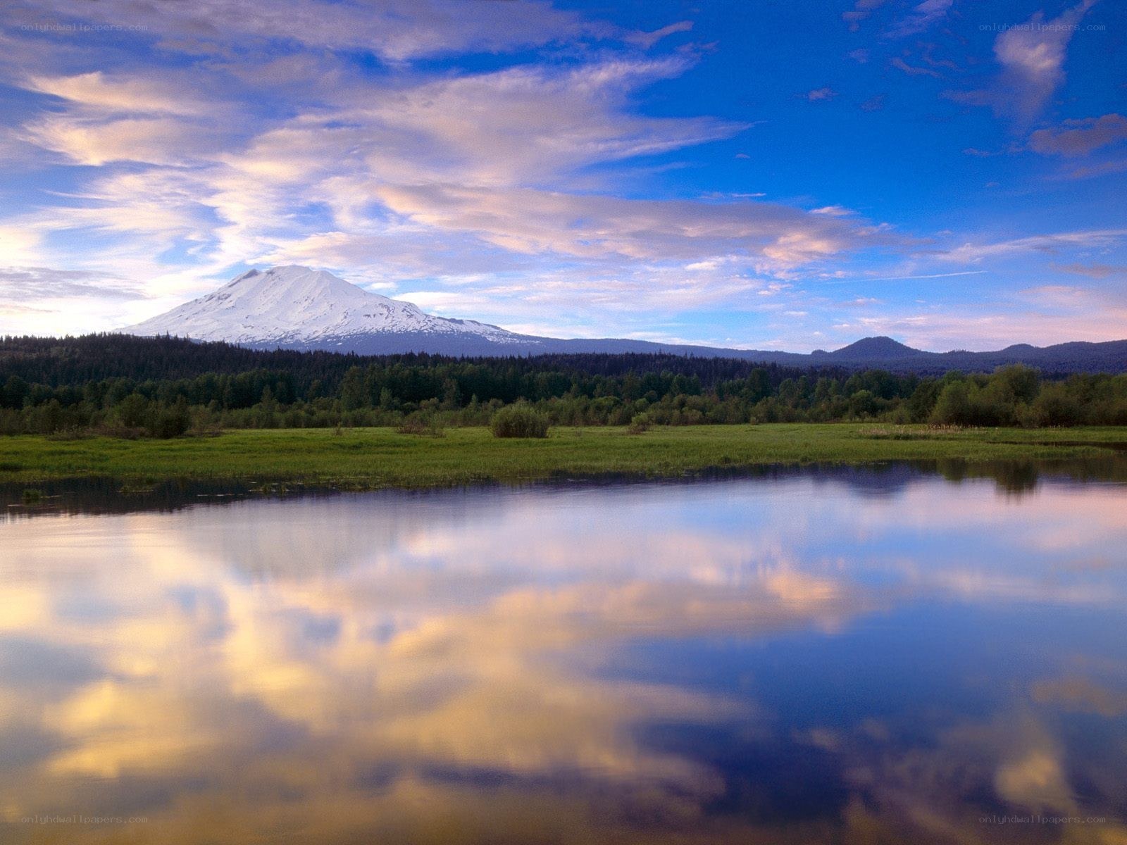 Snow-capped mountain reflected in lake