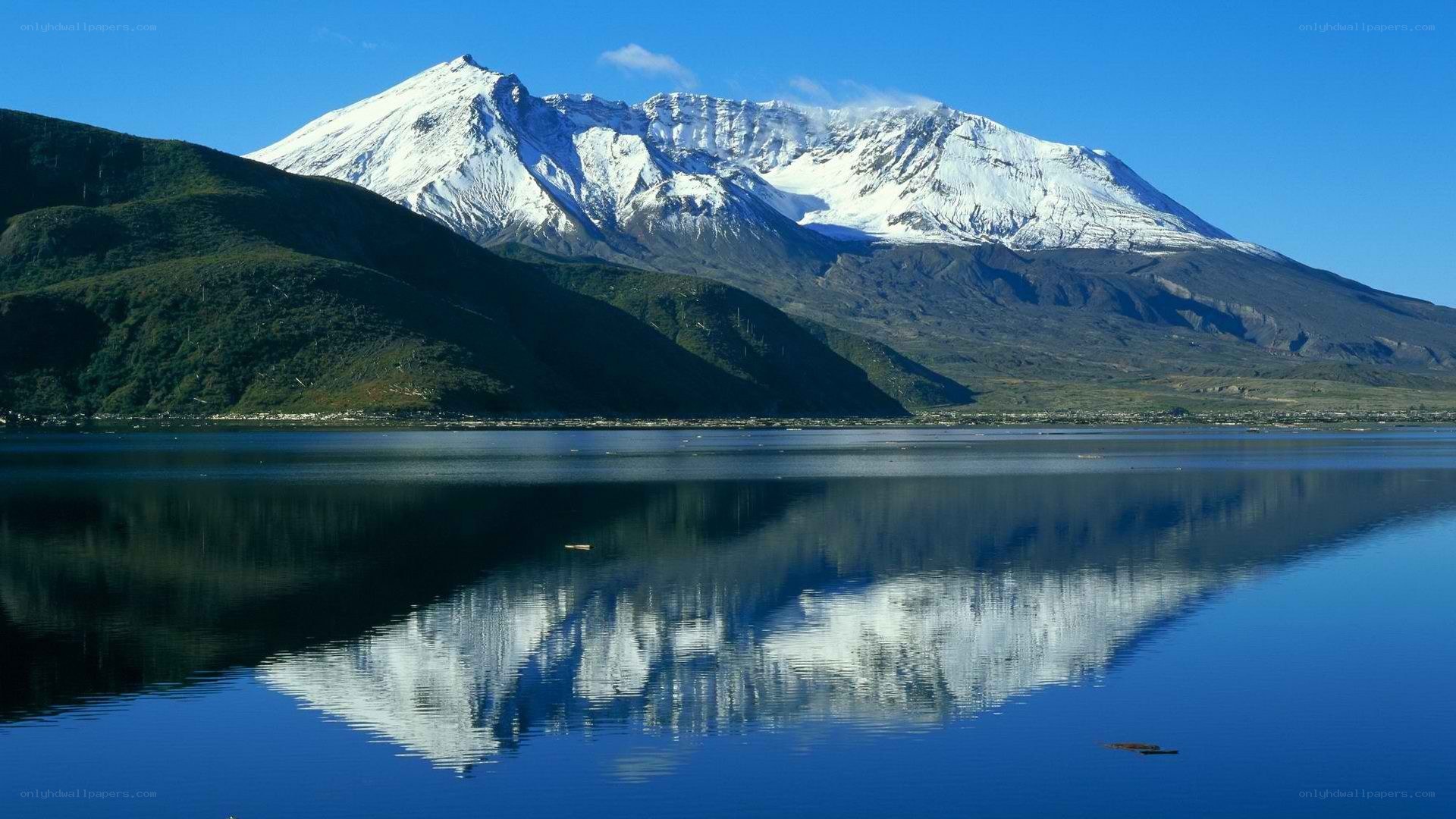 Snow-capped mountain reflected in lake