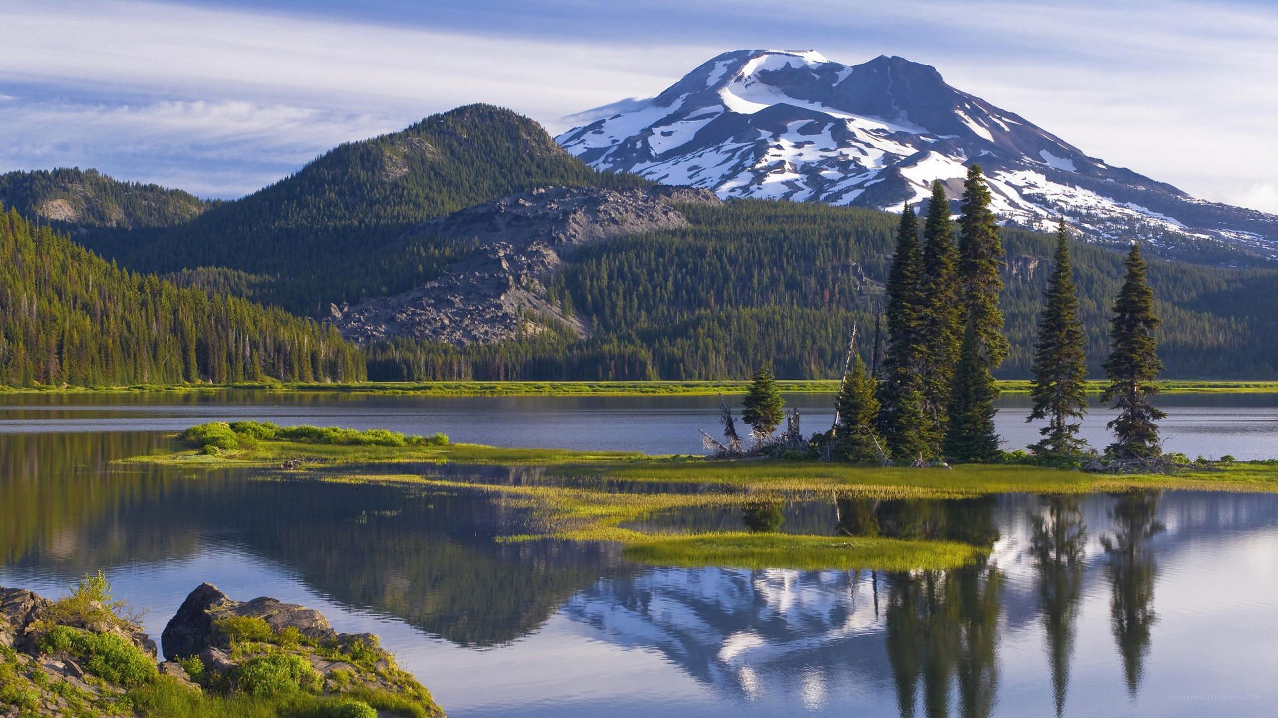 Snow-capped mountain reflected in lake