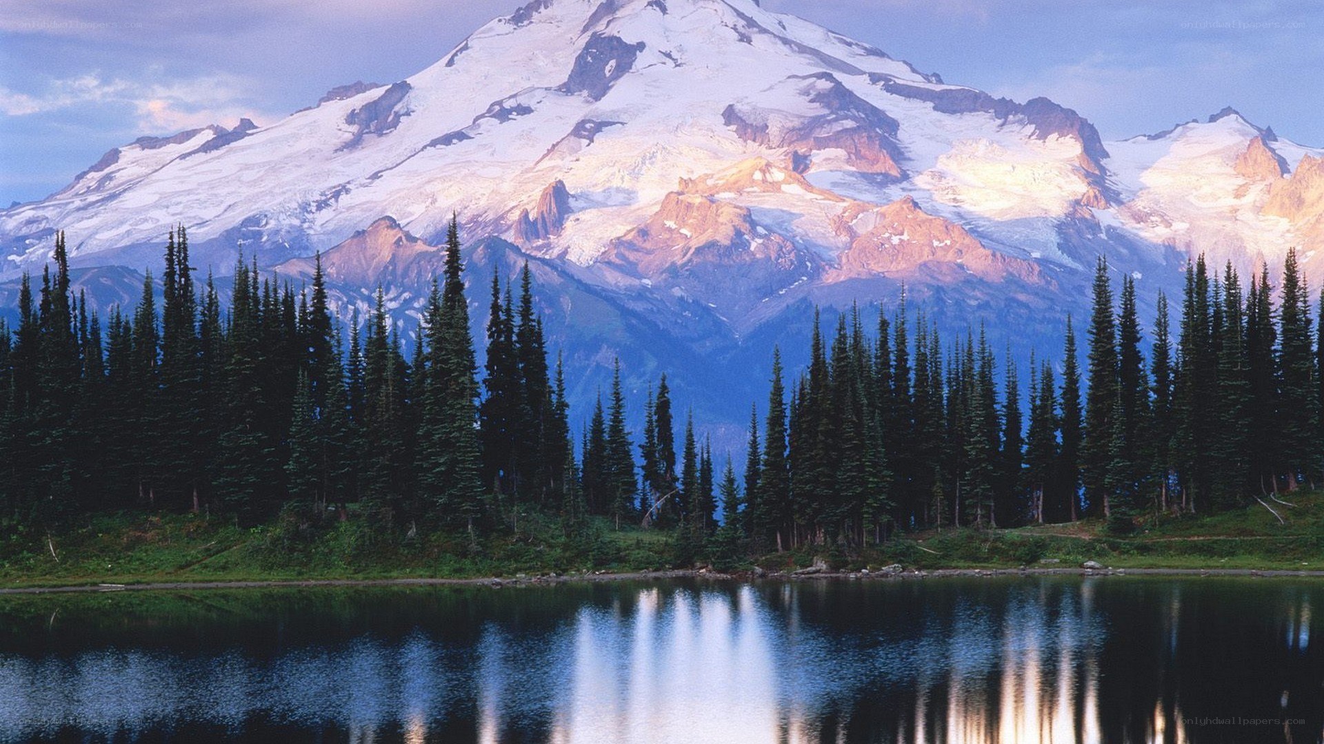 Snow-capped mountain reflected in lake