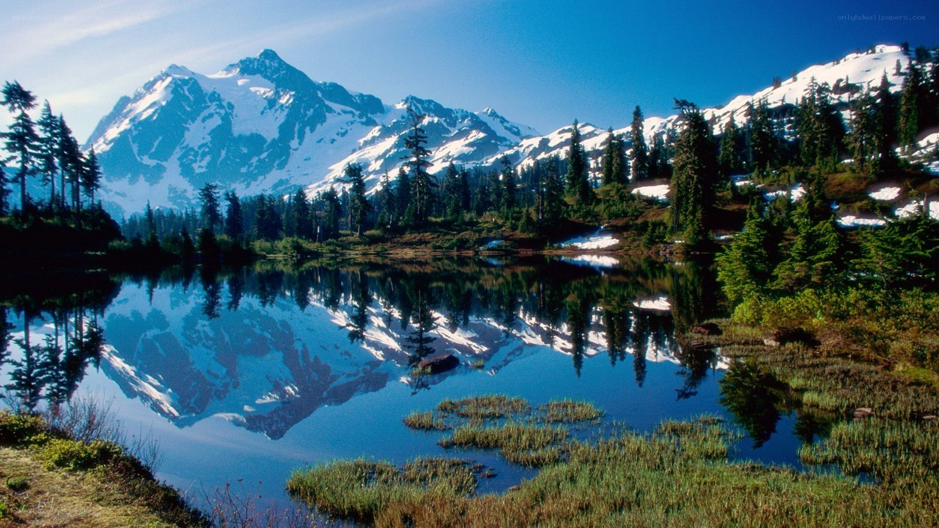 Snow-capped mountain reflected in lake