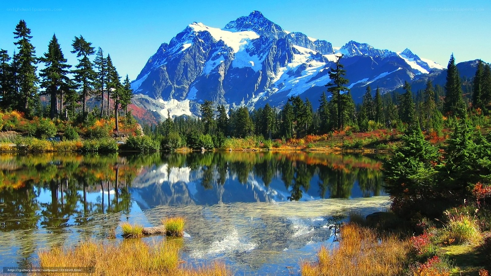 Snow-capped mountain reflected in lake