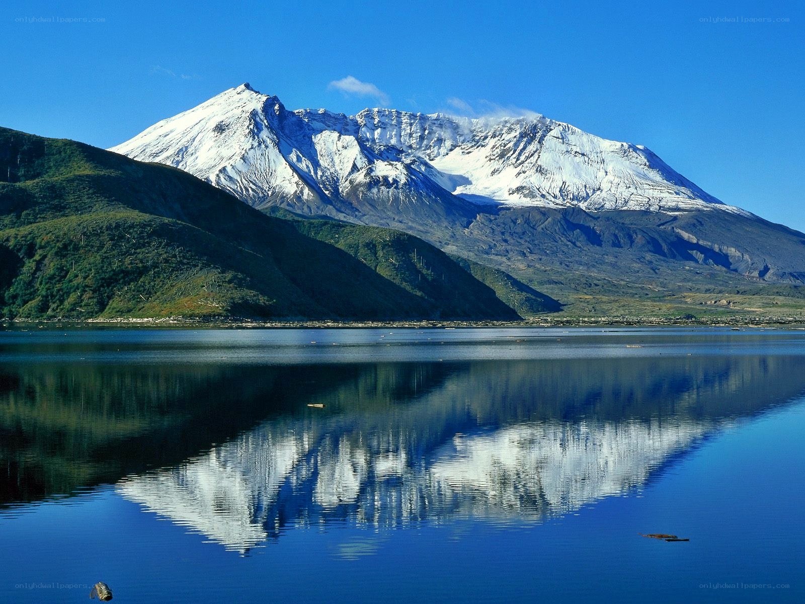 Snow-capped mountain reflected in lake