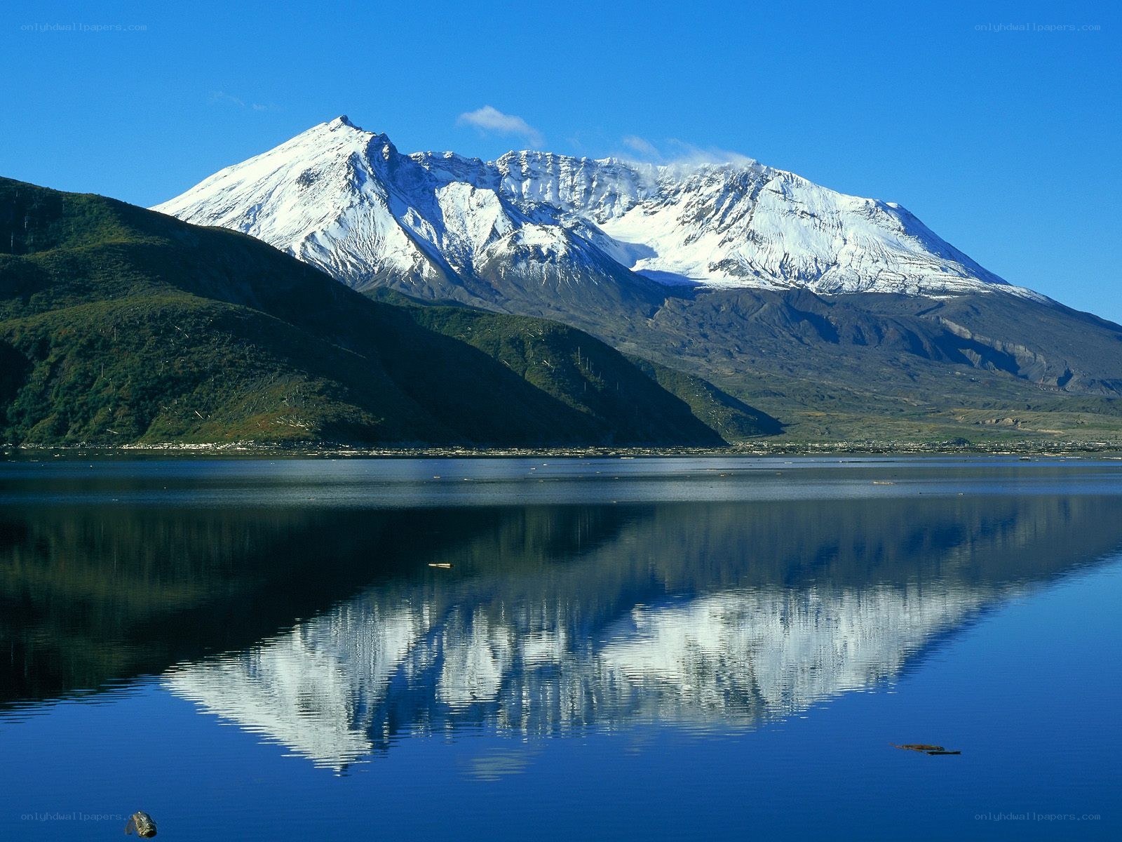 Snow-capped mountain reflected in lake