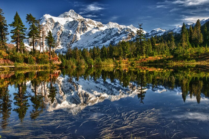 Snow-capped mountain reflected in lake