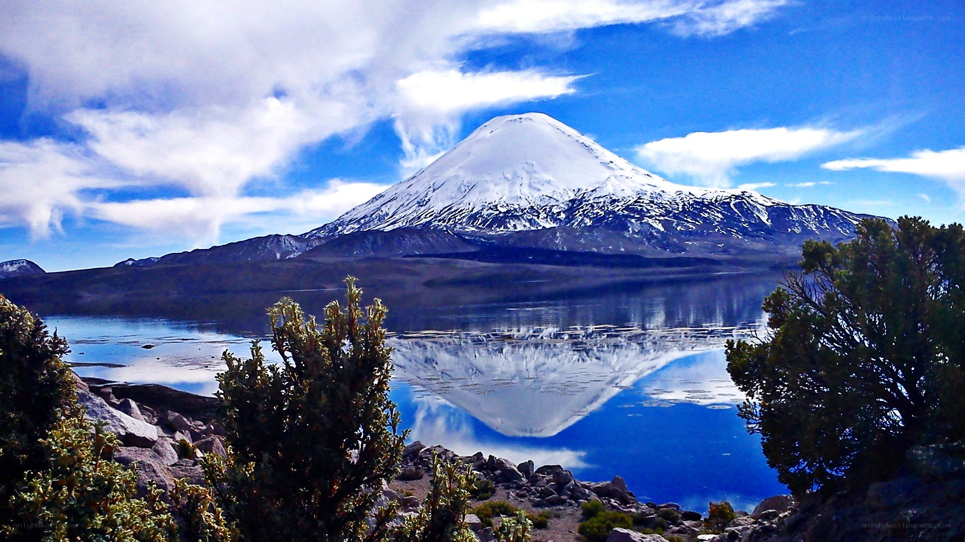 Snow-capped mountain reflected in lake