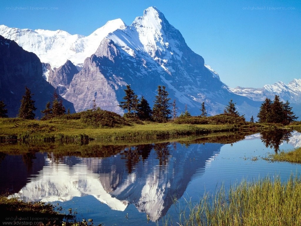 Snow-capped mountain reflected in lake
