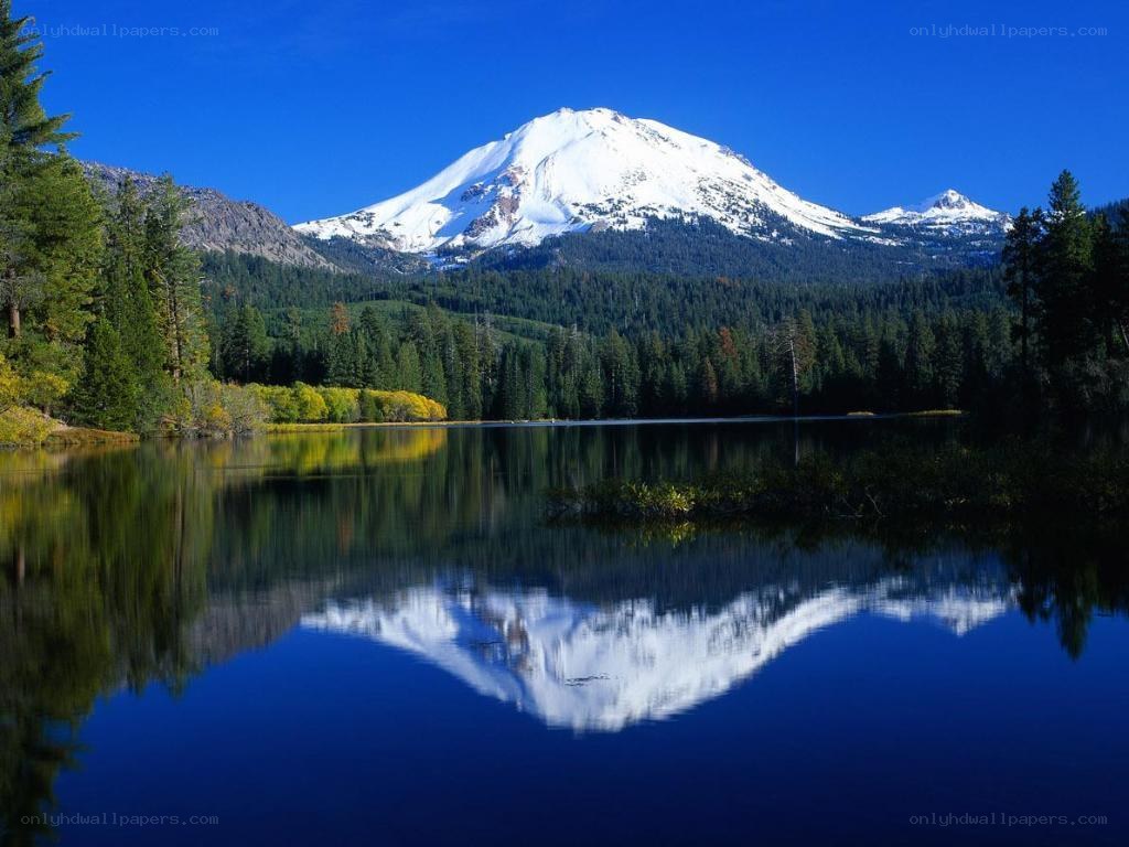 Snow-capped mountain reflected in lake