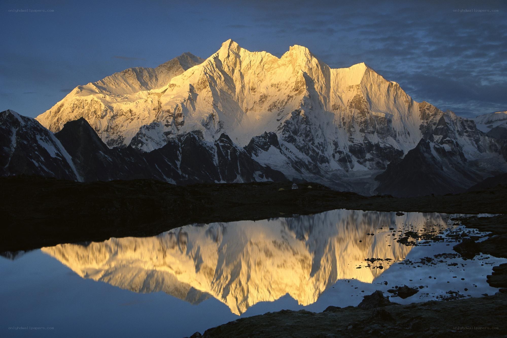 Snow-capped mountain reflected in lake