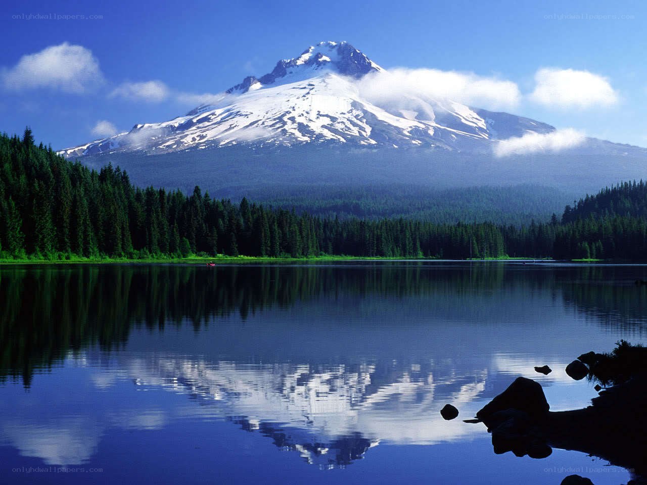 Snow-capped mountain reflected in lake