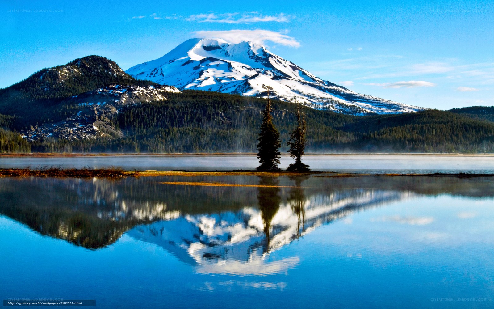 Snow-capped mountain reflected in lake