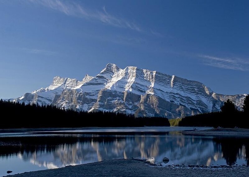 Snow-capped mountain reflected in lake