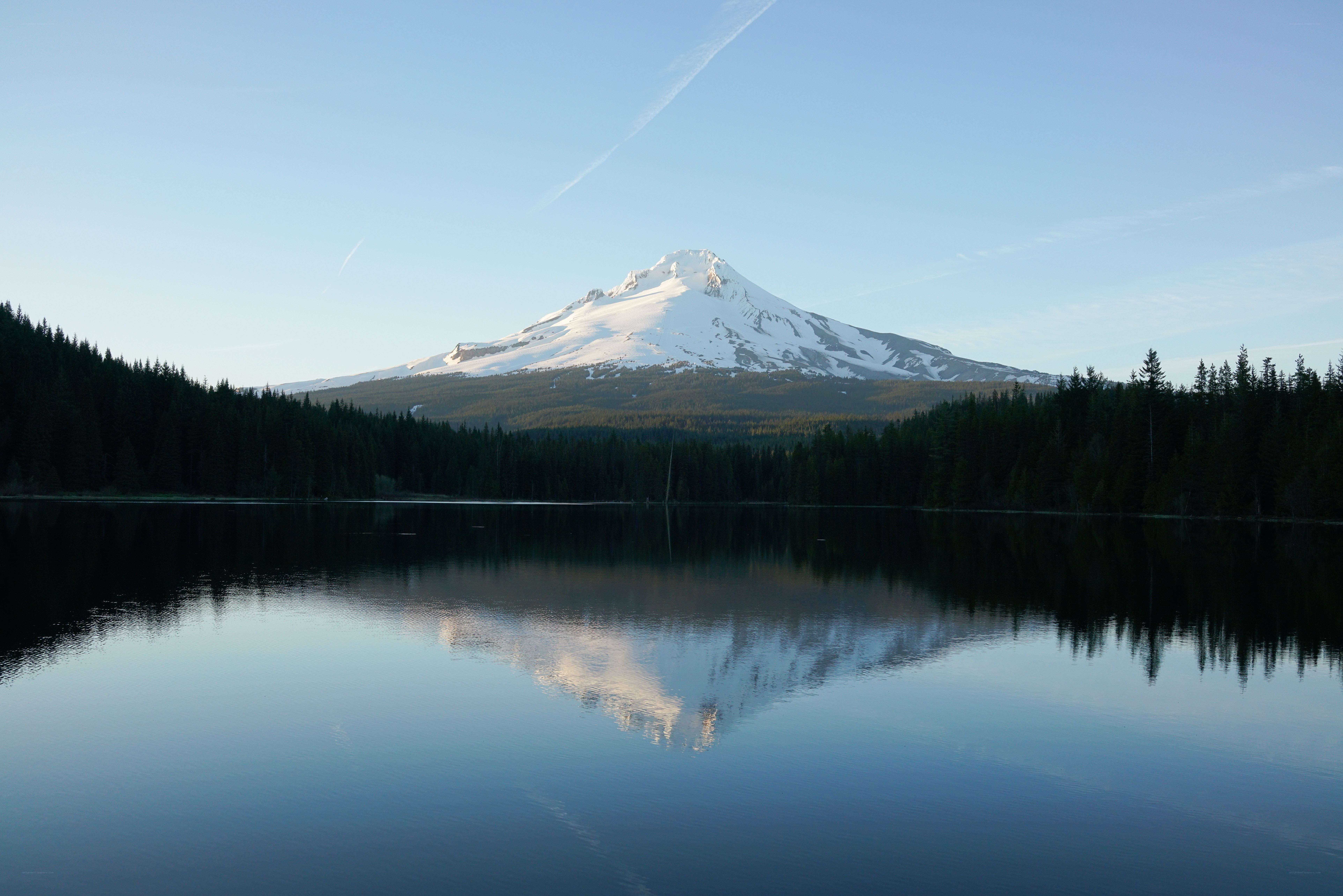 Snow-capped mountain reflected in lake