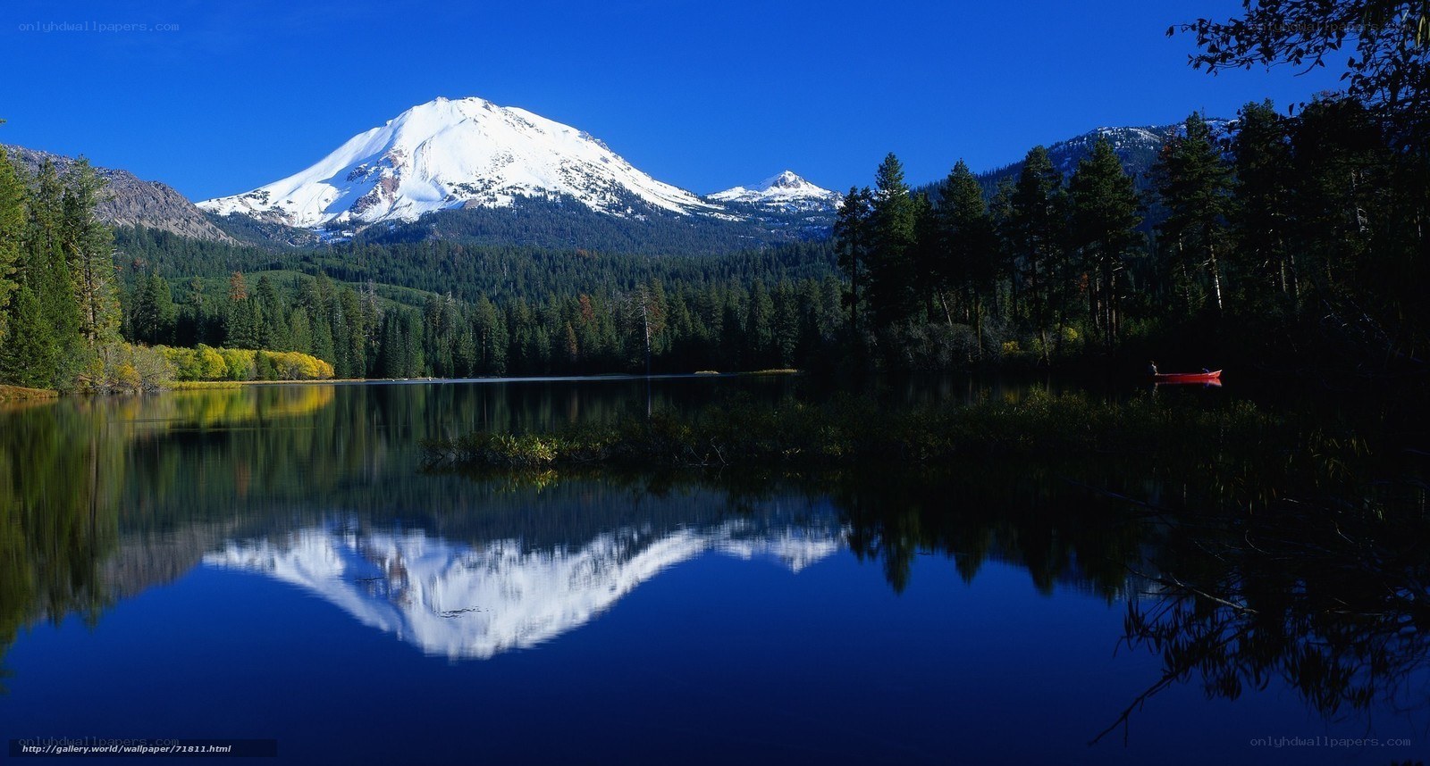Snow-capped mountain reflected in lake