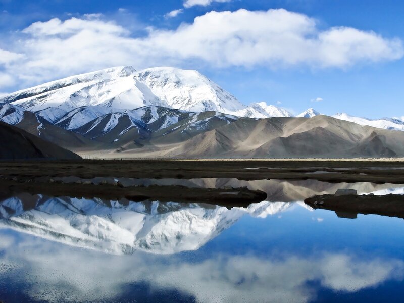 Snow-capped mountain reflection