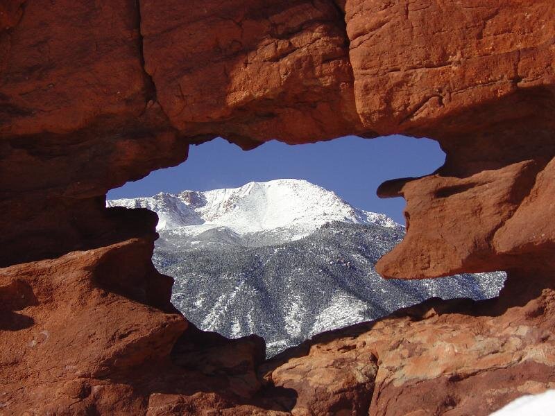 Snow-capped Mountain Through Rock