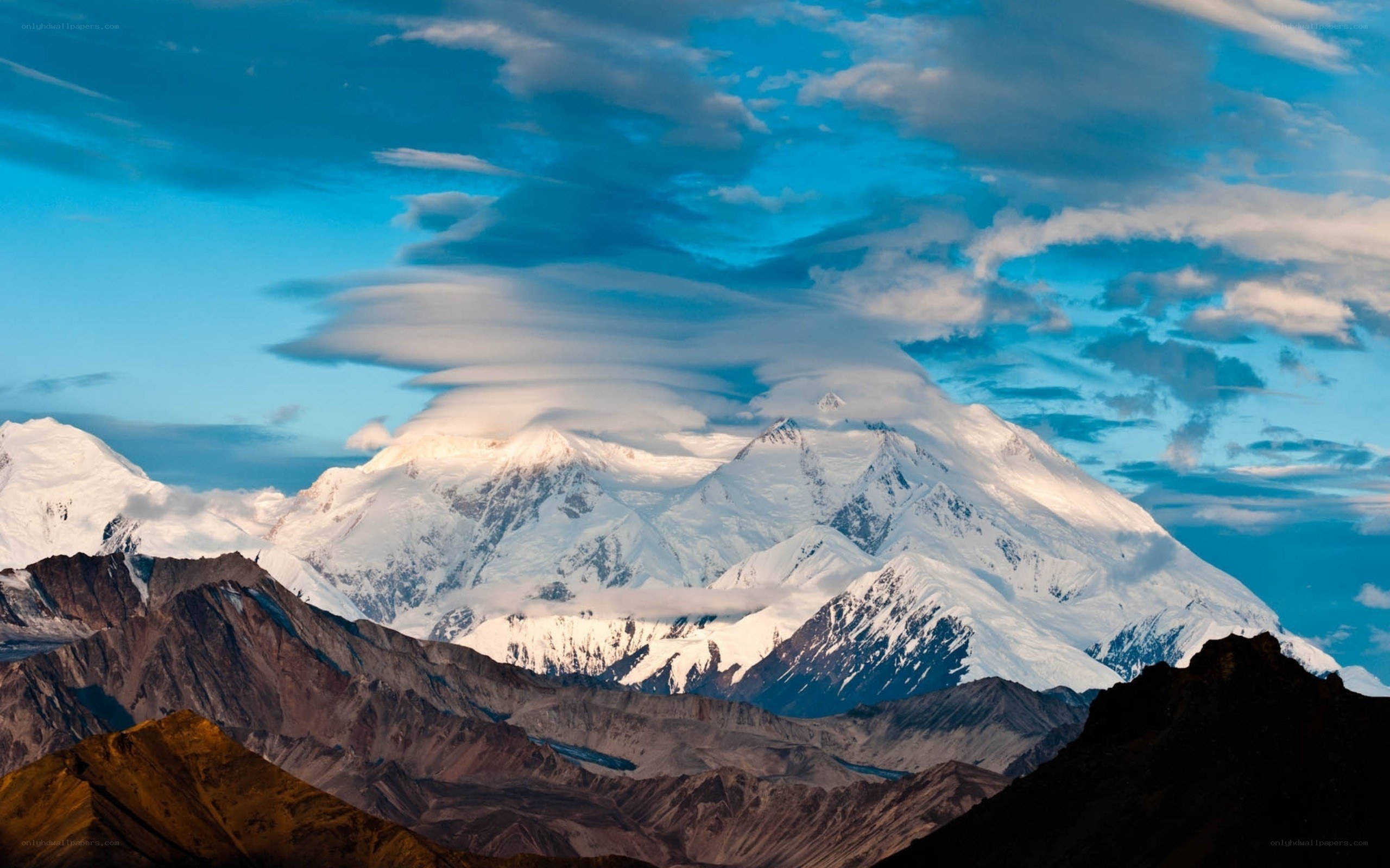 snow-capped mountain under blue sky