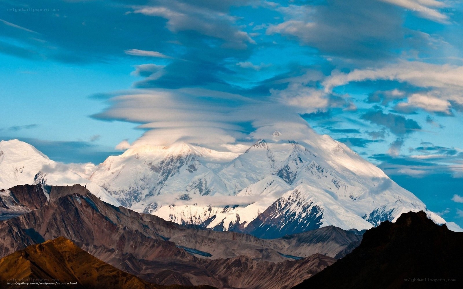 Snow-capped mountain under blue sky