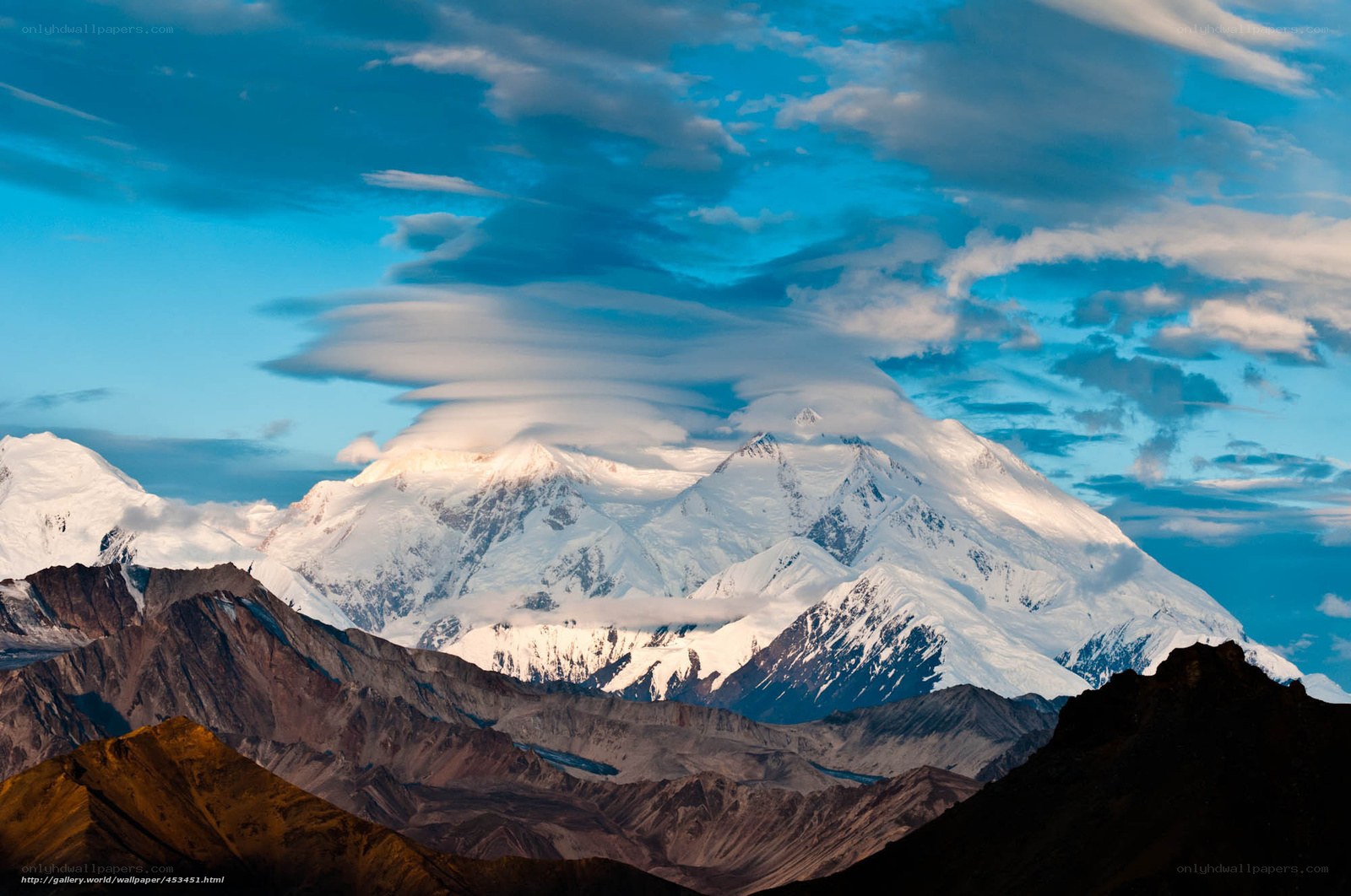 Snow-capped mountain under blue sky