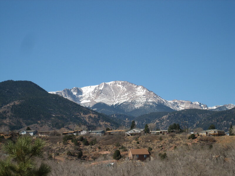 snow-capped mountain with houses