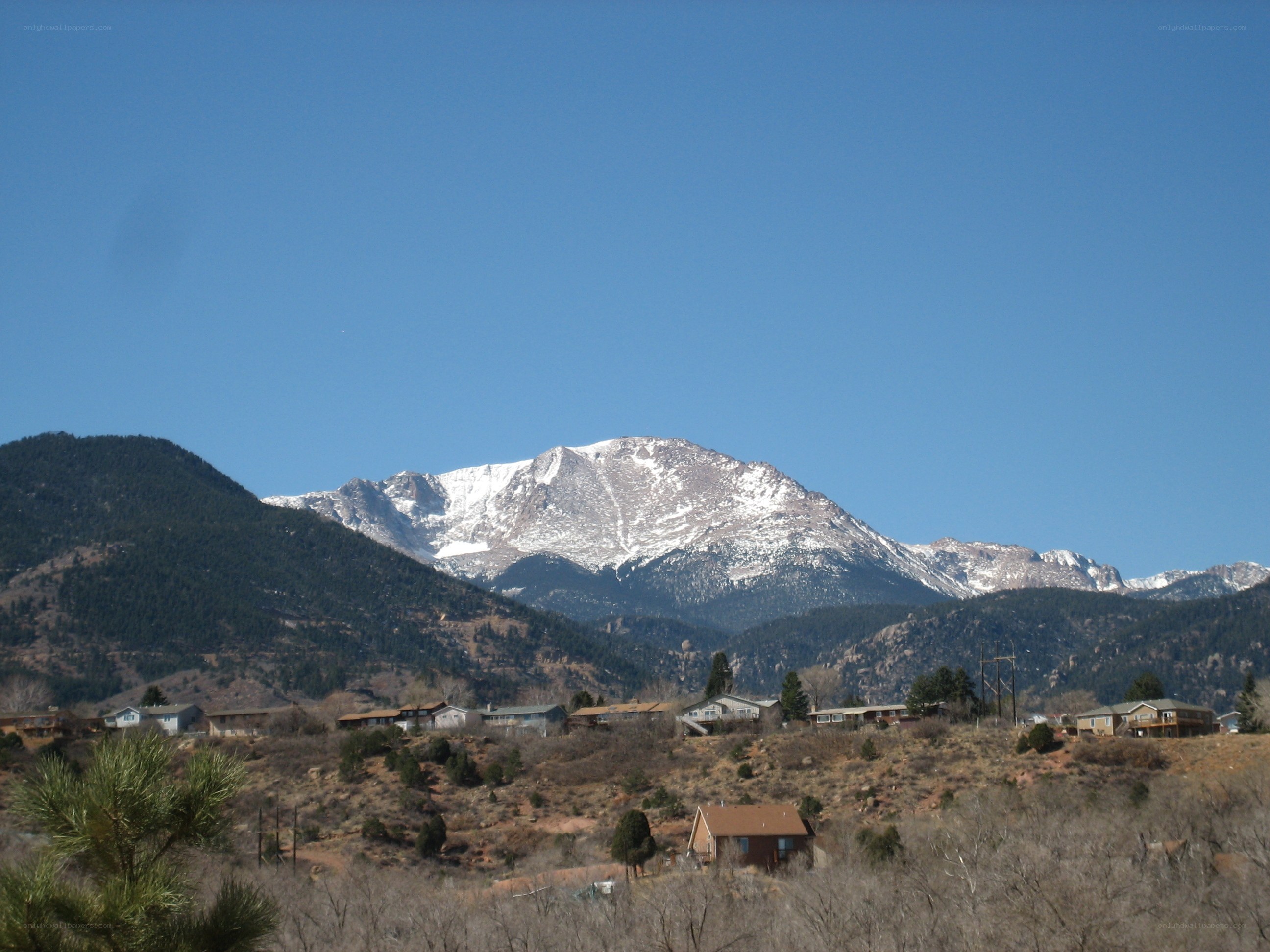 snow-capped mountain with houses
