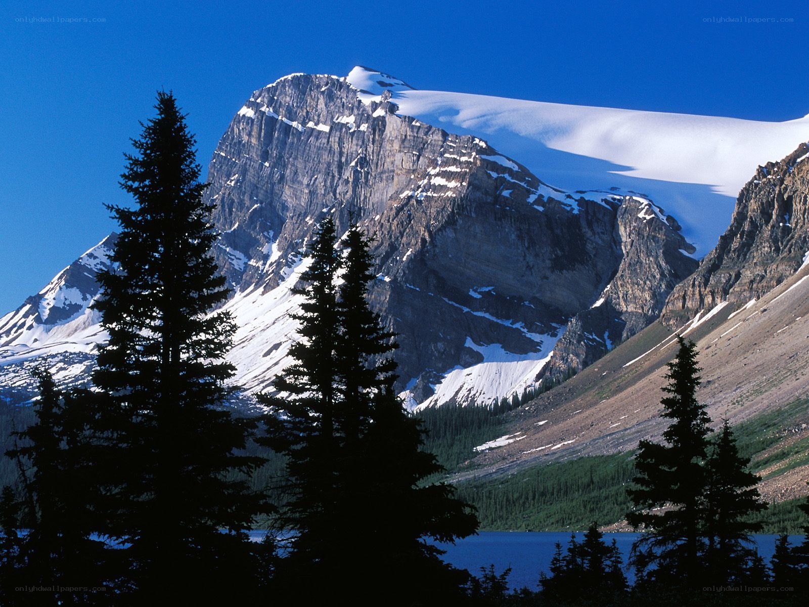 Snow-capped mountain with lake