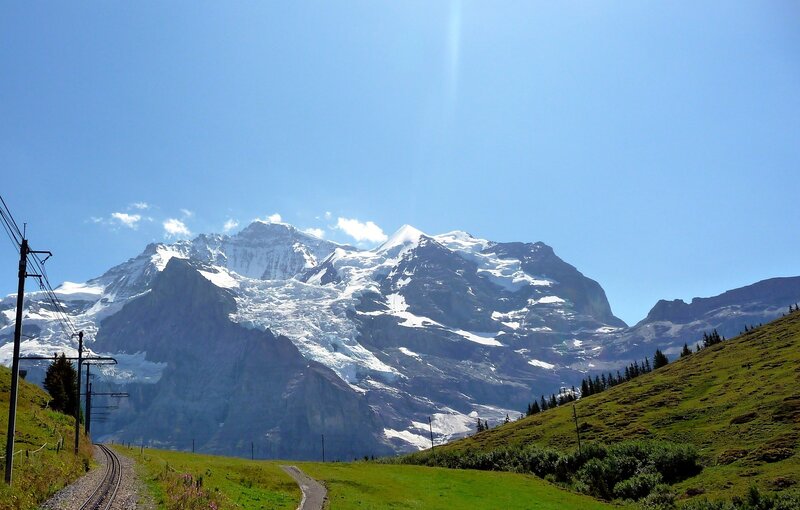 Snow-capped mountain with train tracks
