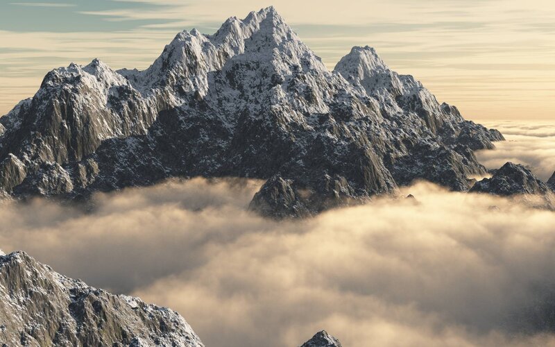 Snow-capped mountains above clouds