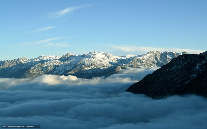 Snow-capped mountains above clouds