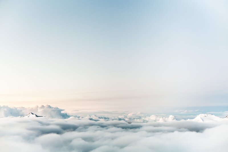 Snow-capped Mountains Above Clouds — White, Serene