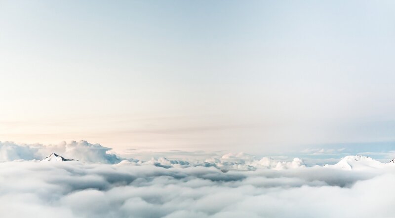 Snow-capped Mountains Above Clouds — White
