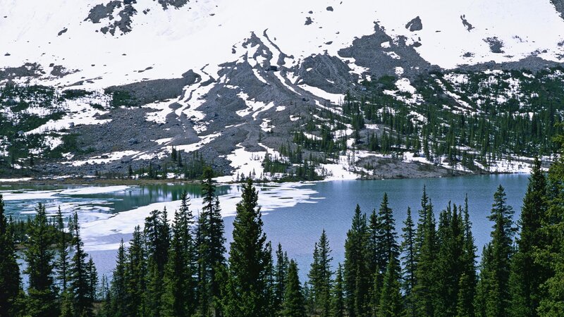 snow-capped mountains and alpine lake