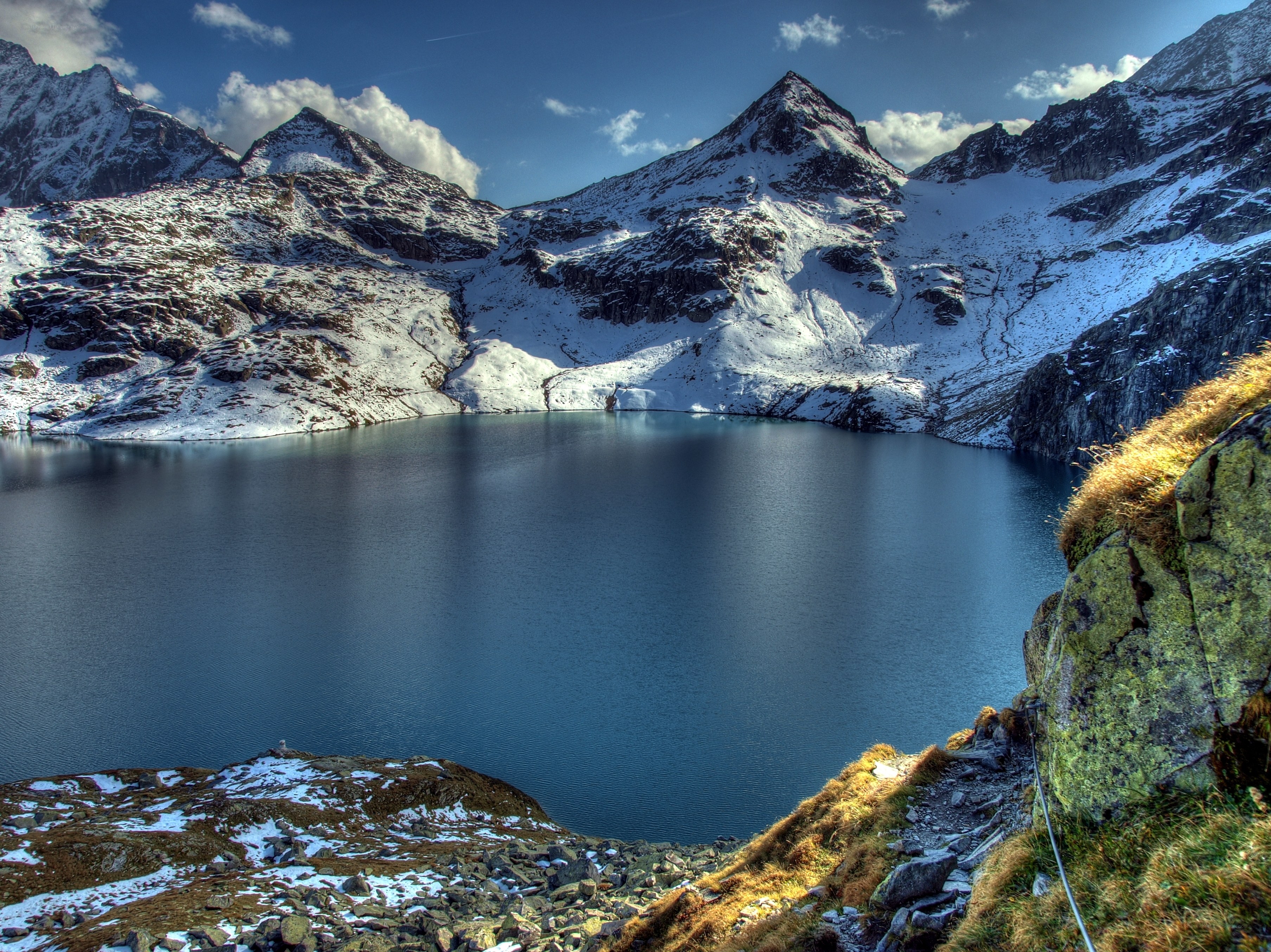 Snow-capped mountains and alpine lake