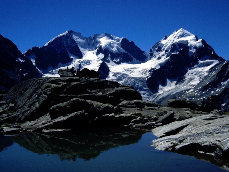 Snow-capped mountains and alpine lake