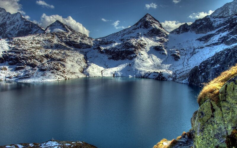 Snow-capped mountains and alpine lake