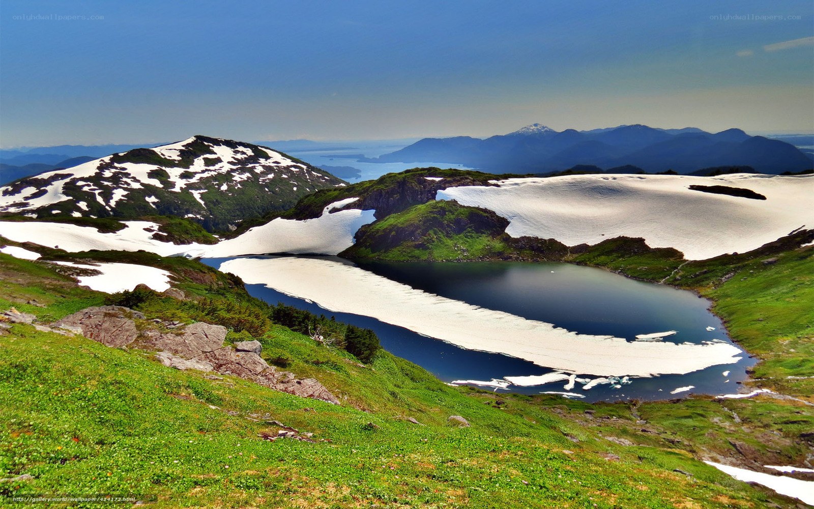 Snow-capped mountains and alpine lake