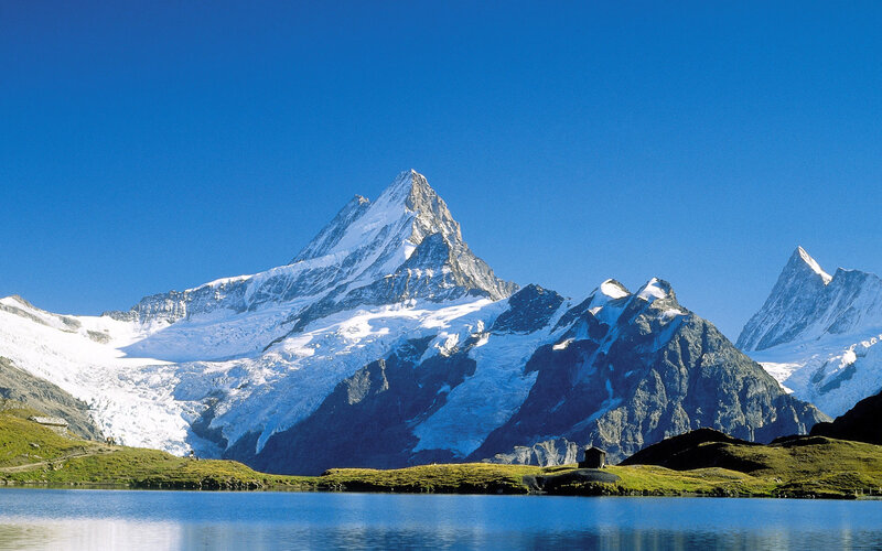 Snow-capped mountains and alpine lake