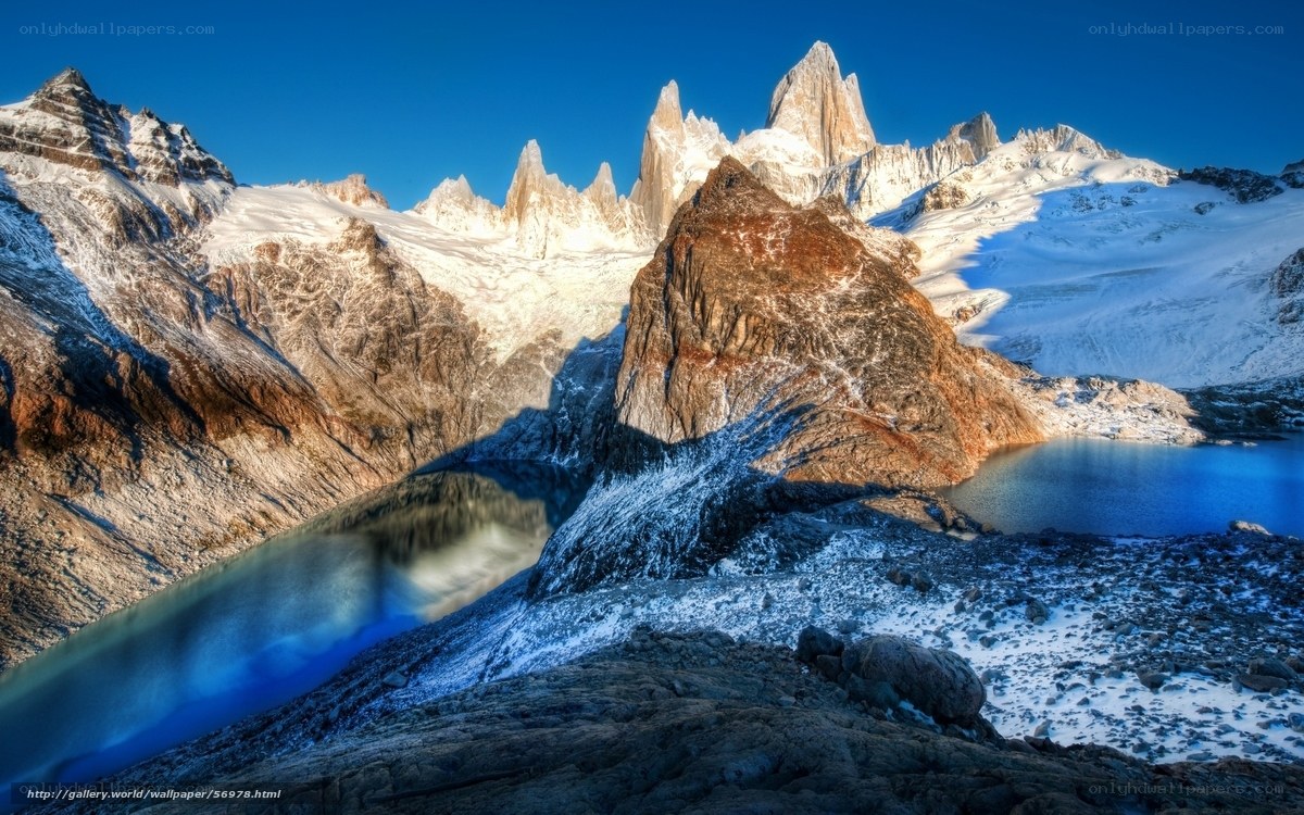 Snow-capped mountains and alpine lake