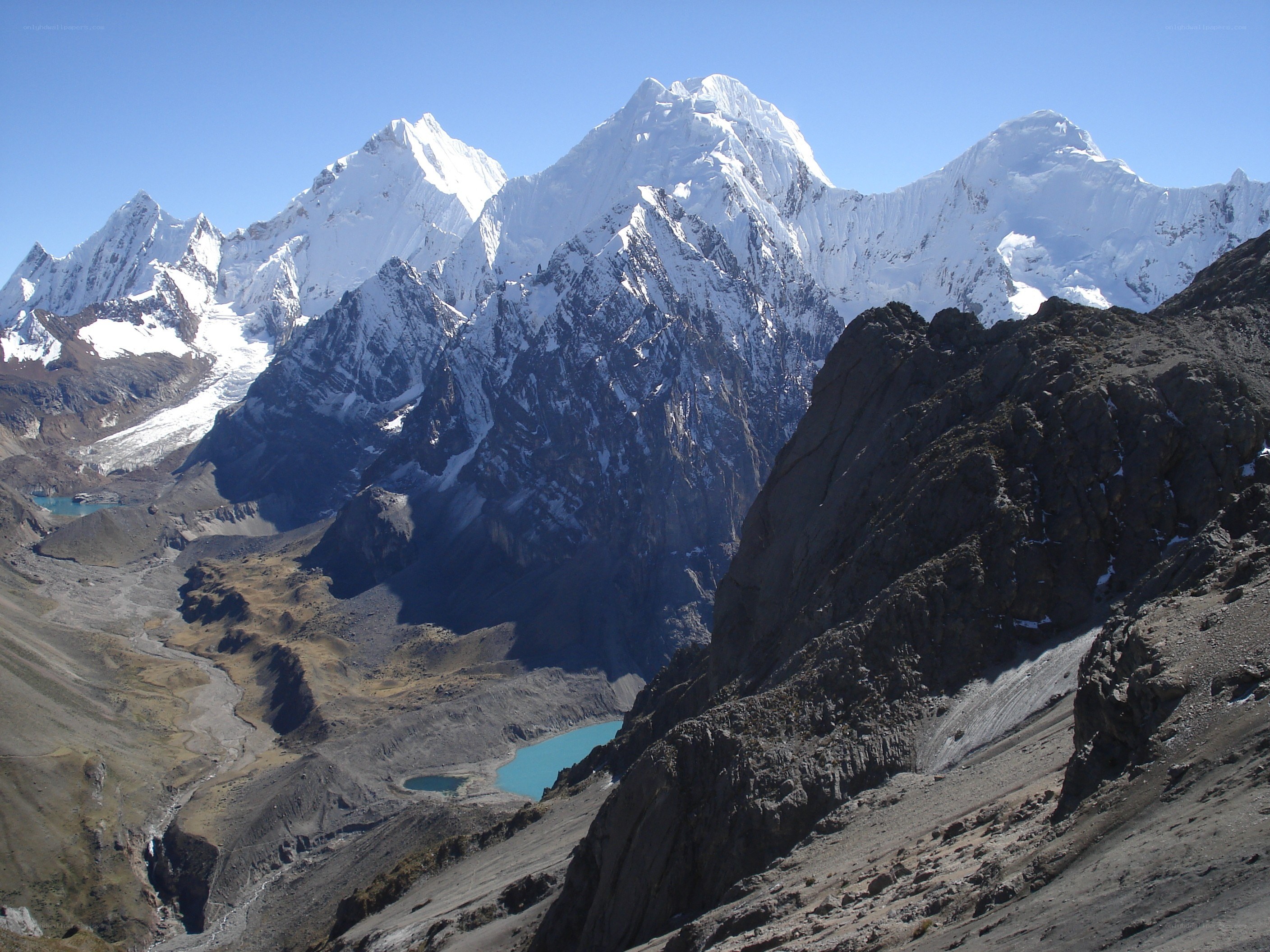 snow-capped mountains and alpine lakes