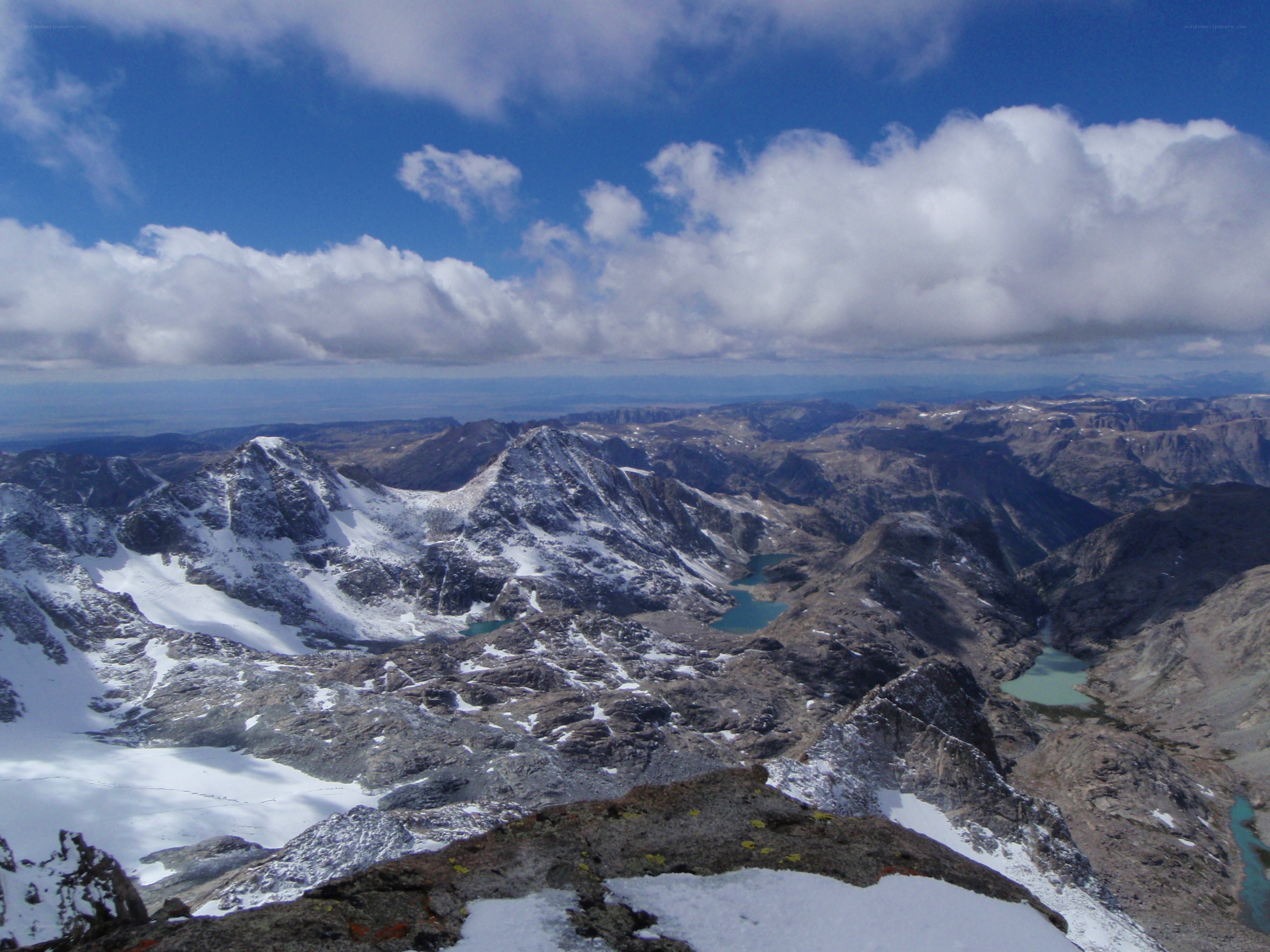 snow-capped mountains and alpine lakes