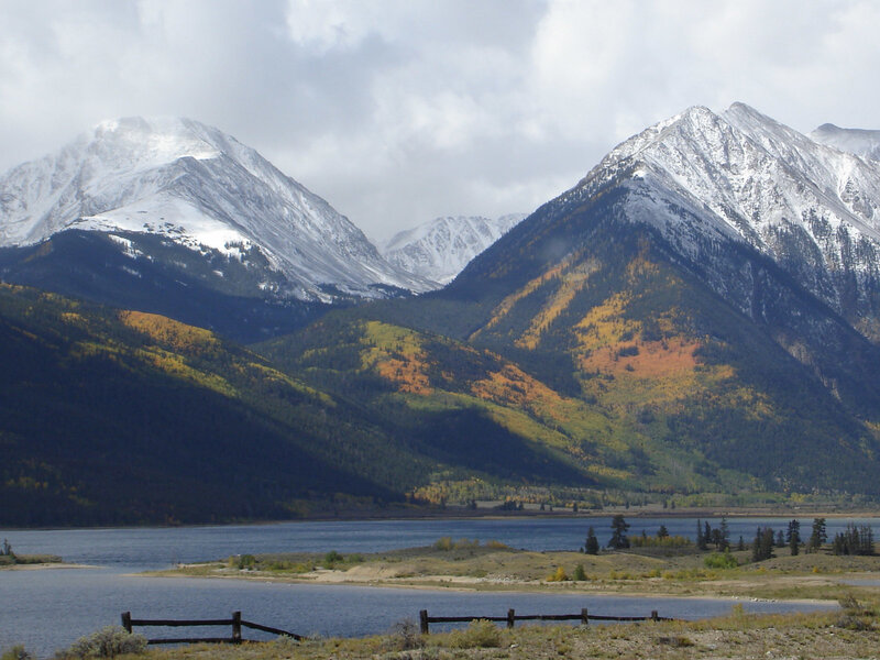Snow-capped mountains and autumn lake