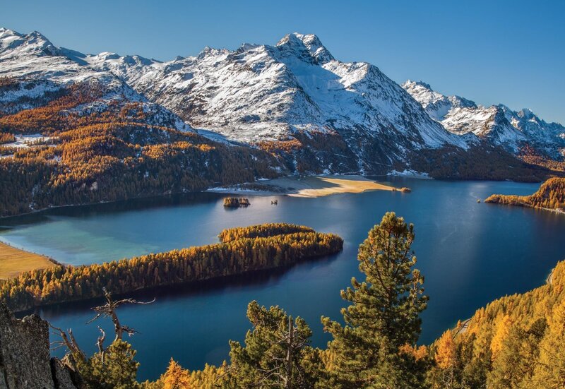 Snow-capped mountains and autumn lake