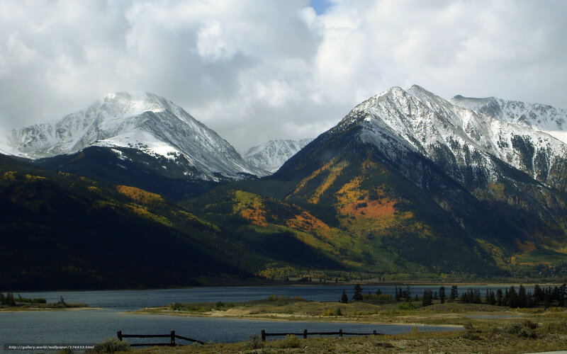 Snow-capped mountains and autumn lake
