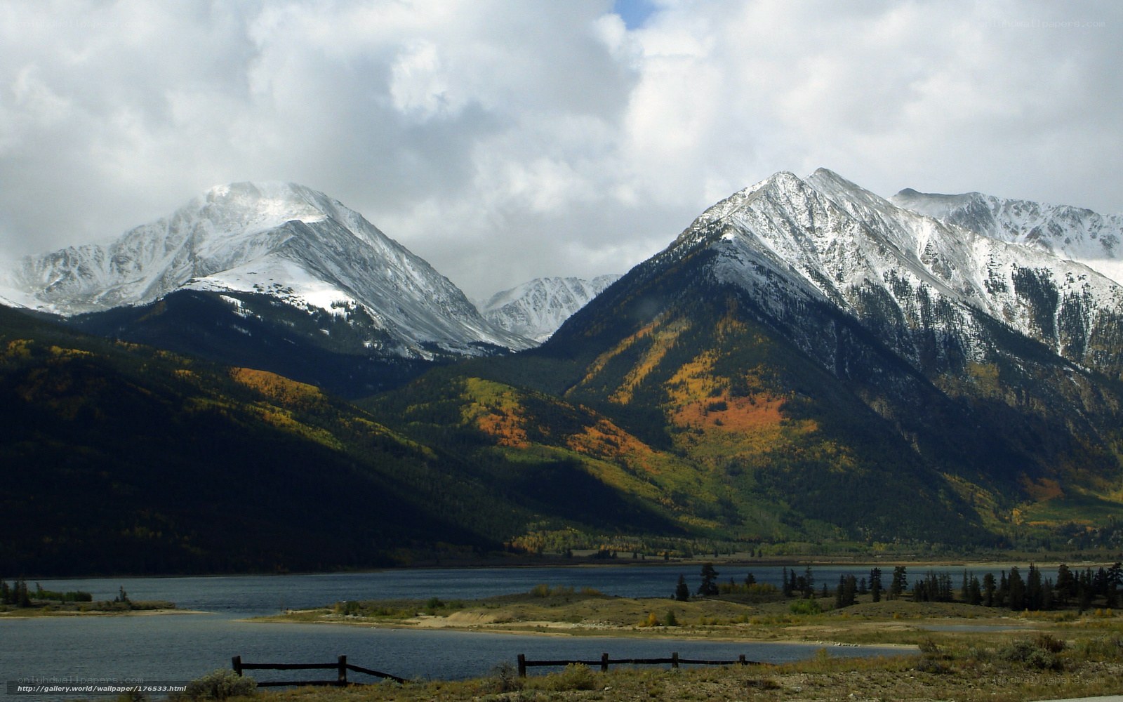 Snow-capped mountains and autumn lake