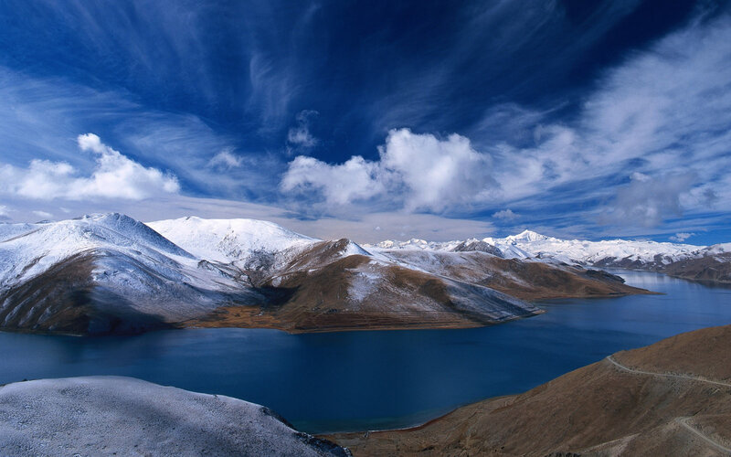 Snow-capped mountains and blue lake