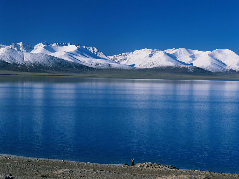 Snow-capped mountains and blue lake