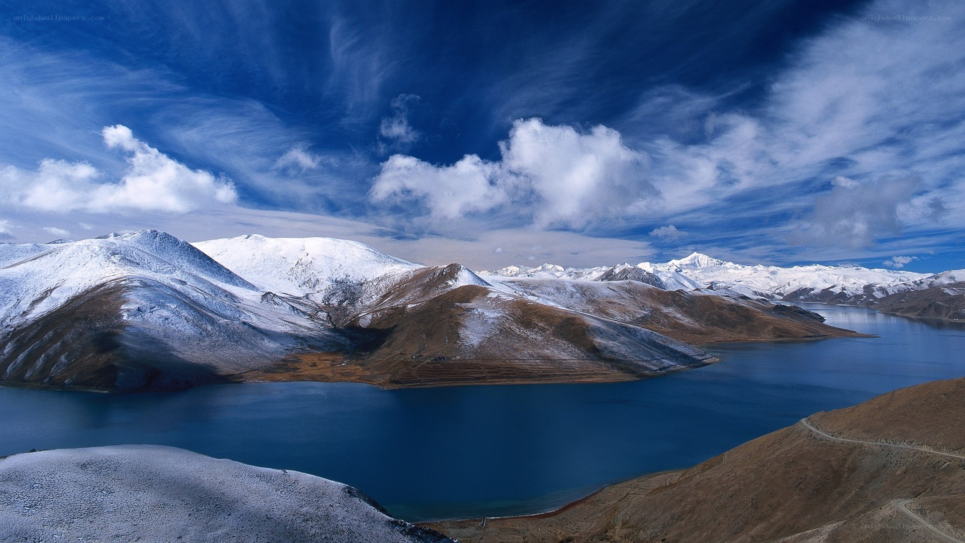 snow-capped mountains and blue lake