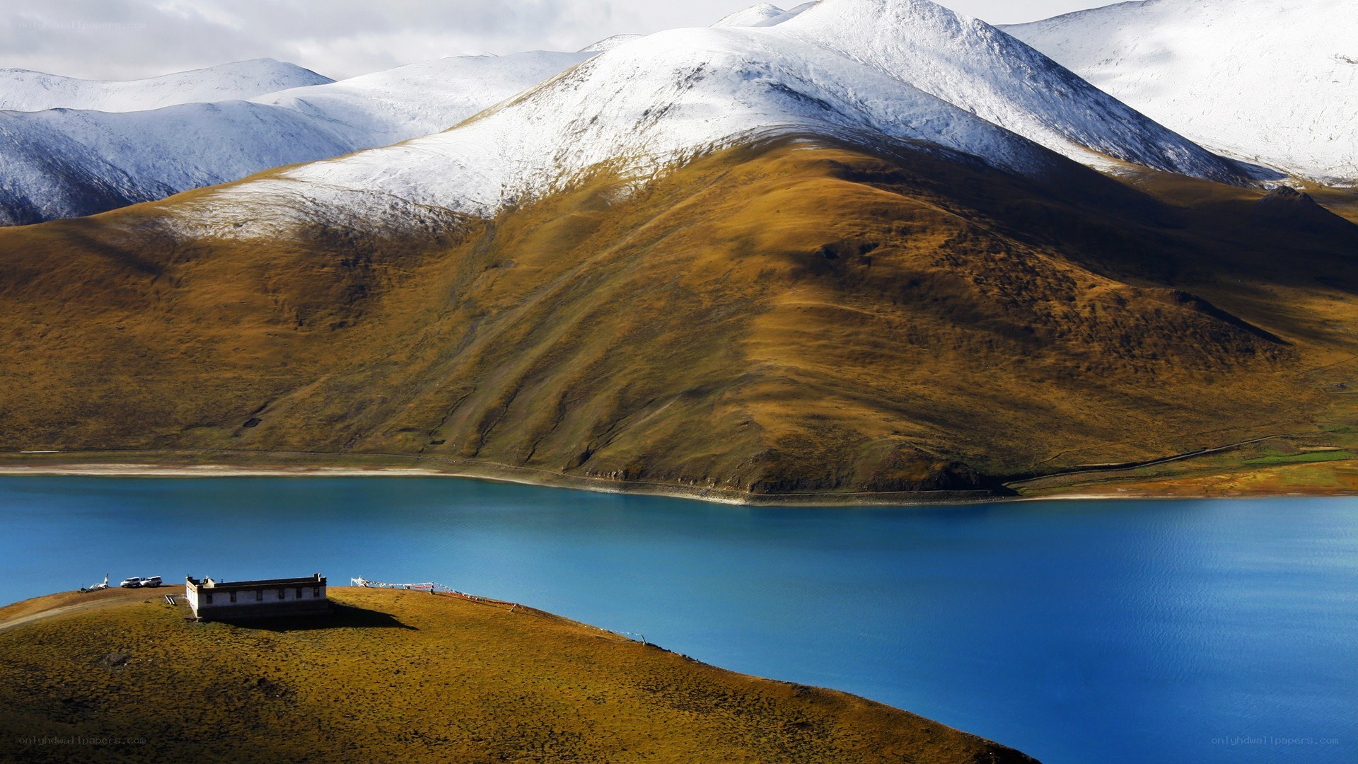 Snow-capped mountains and blue lake