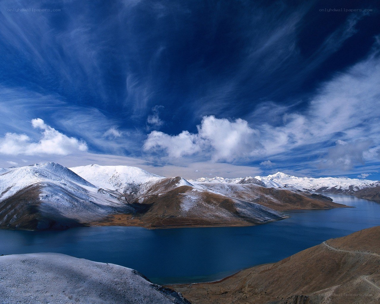 Snow-capped mountains and blue lake