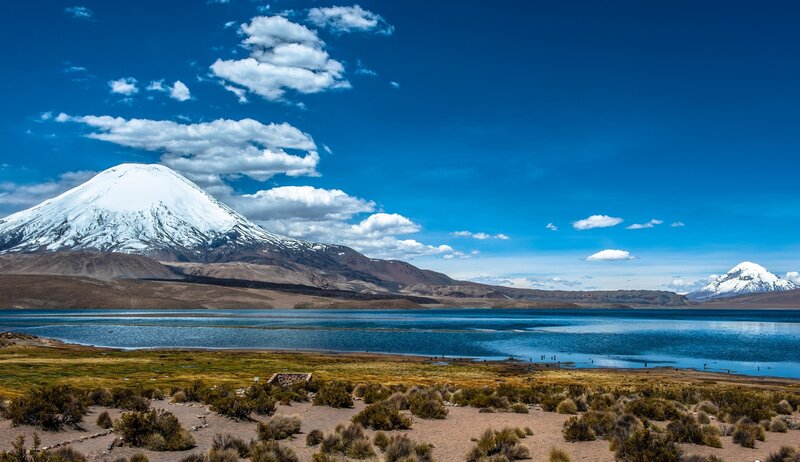 Snow-capped mountains and blue lake